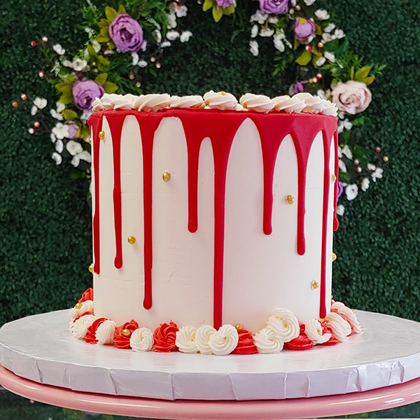 red and white drip cake
